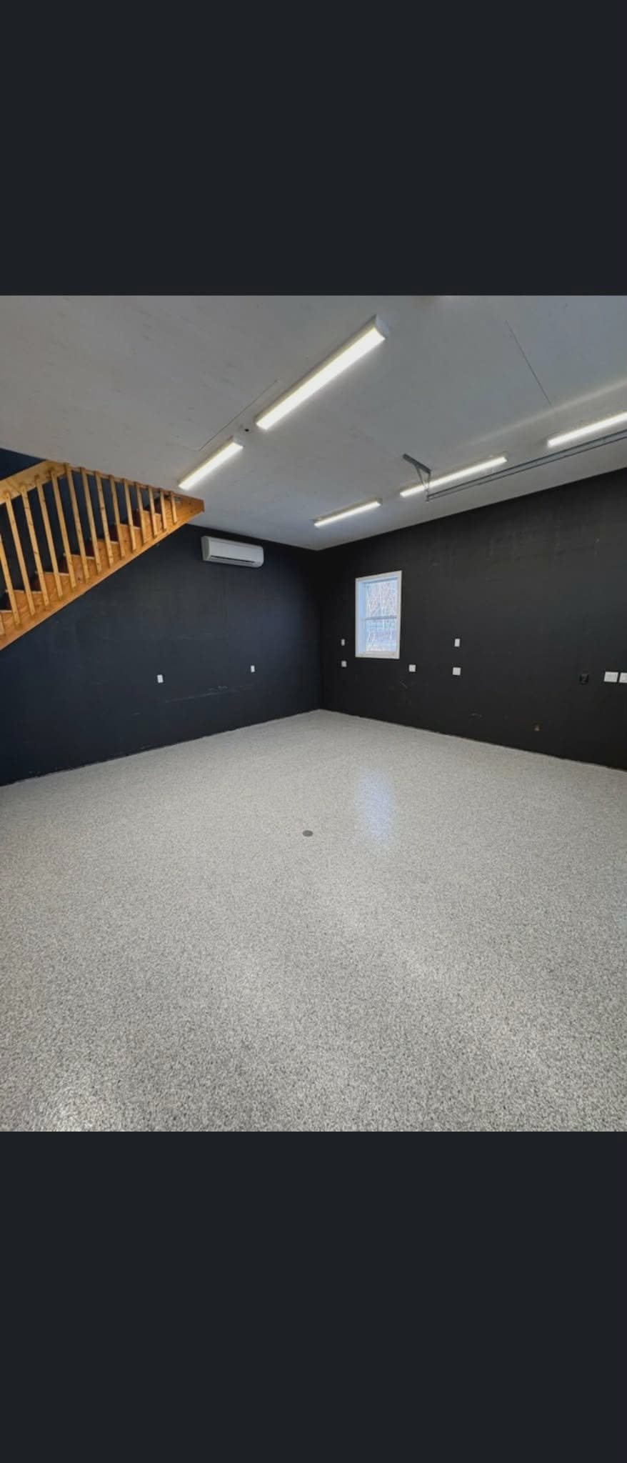 Garage dark walls with fresh epoxy flake floor